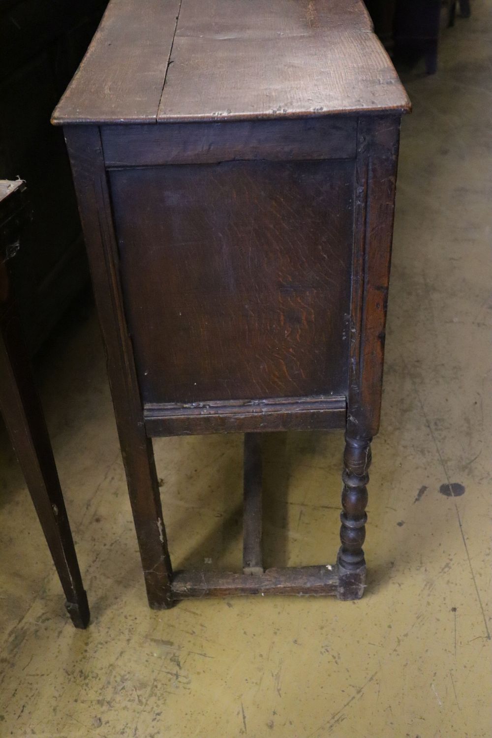 A Tudor style carved oak sideboard, width 119cm depth 36cm height 80cm